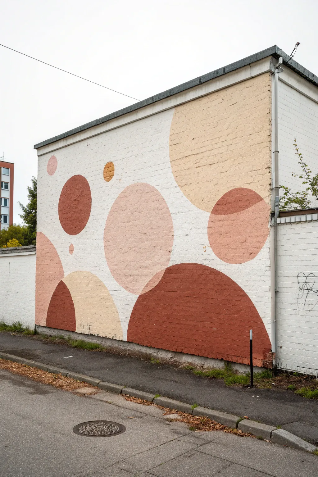 Minimal planets mural with soft spray-painted circles and airy spacing for a calm modern wall