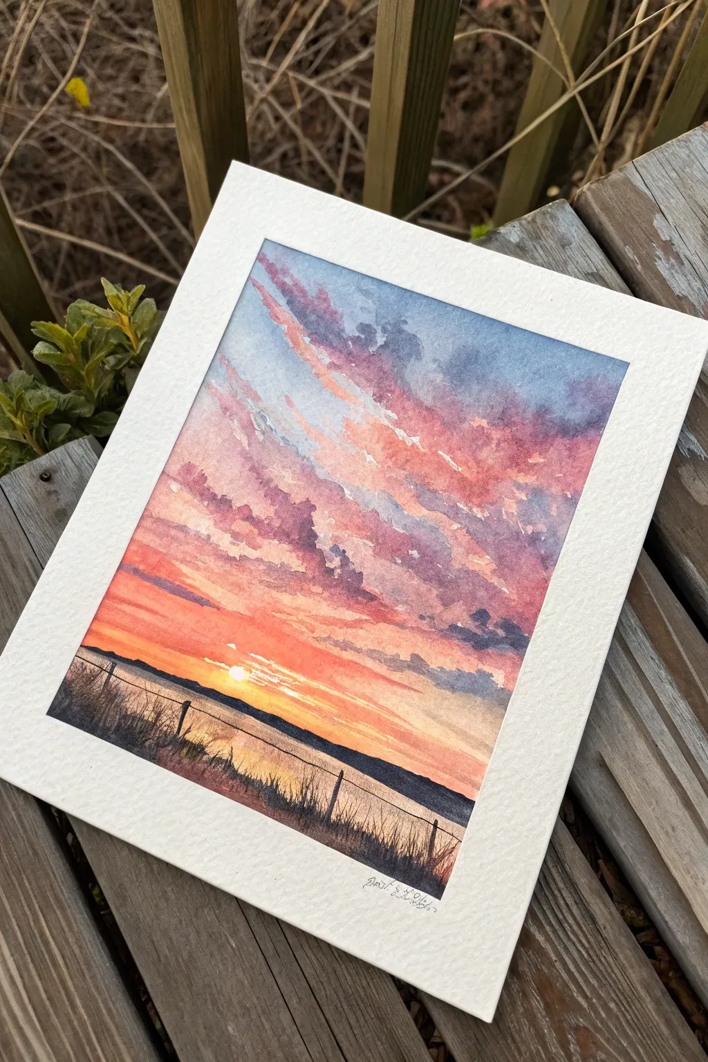 Soft sunset wash with lifted cloud highlights for a dreamy, glowing horizon watercolor idea.