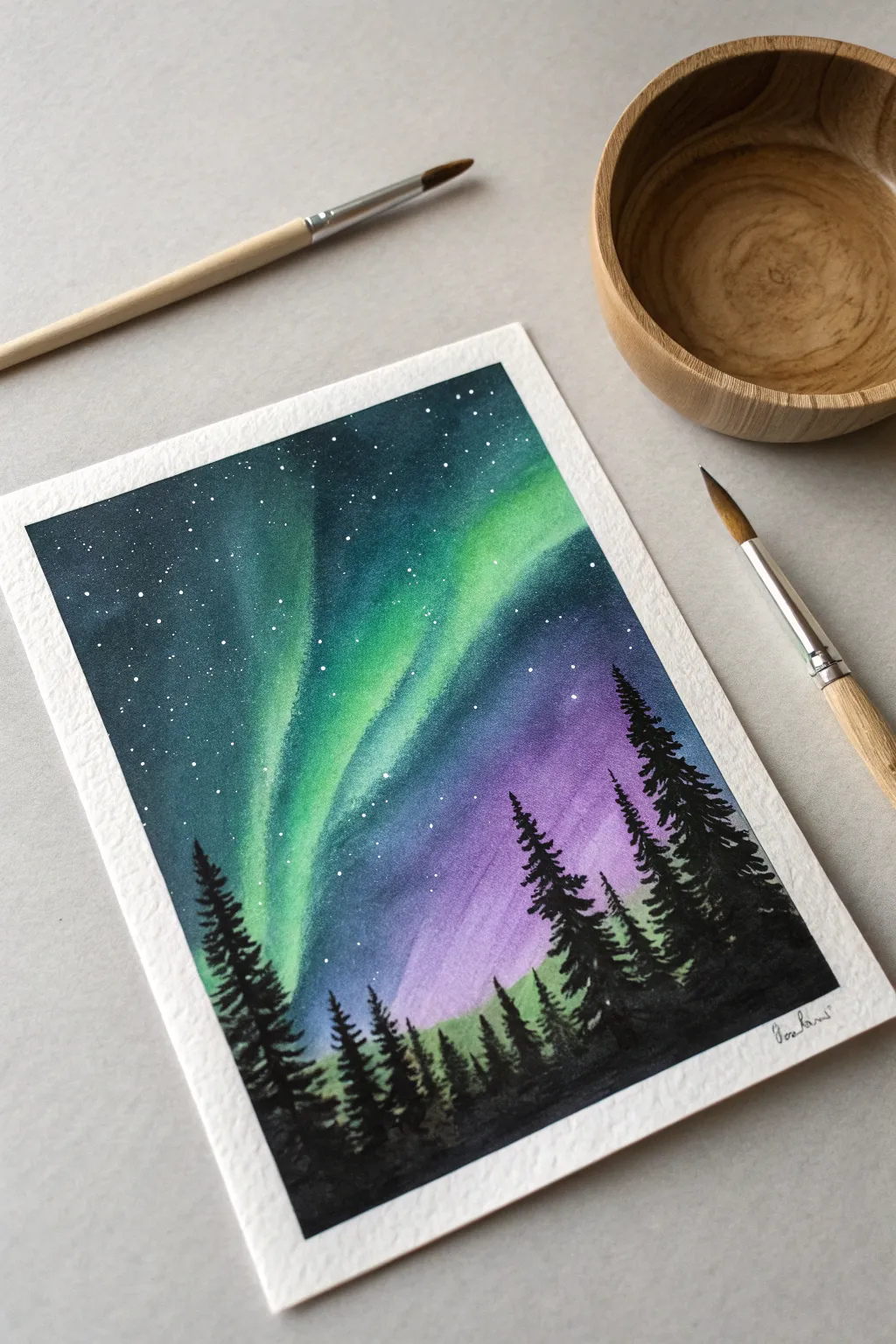 Capture the magic of the winter night sky with this Aurora painting idea.