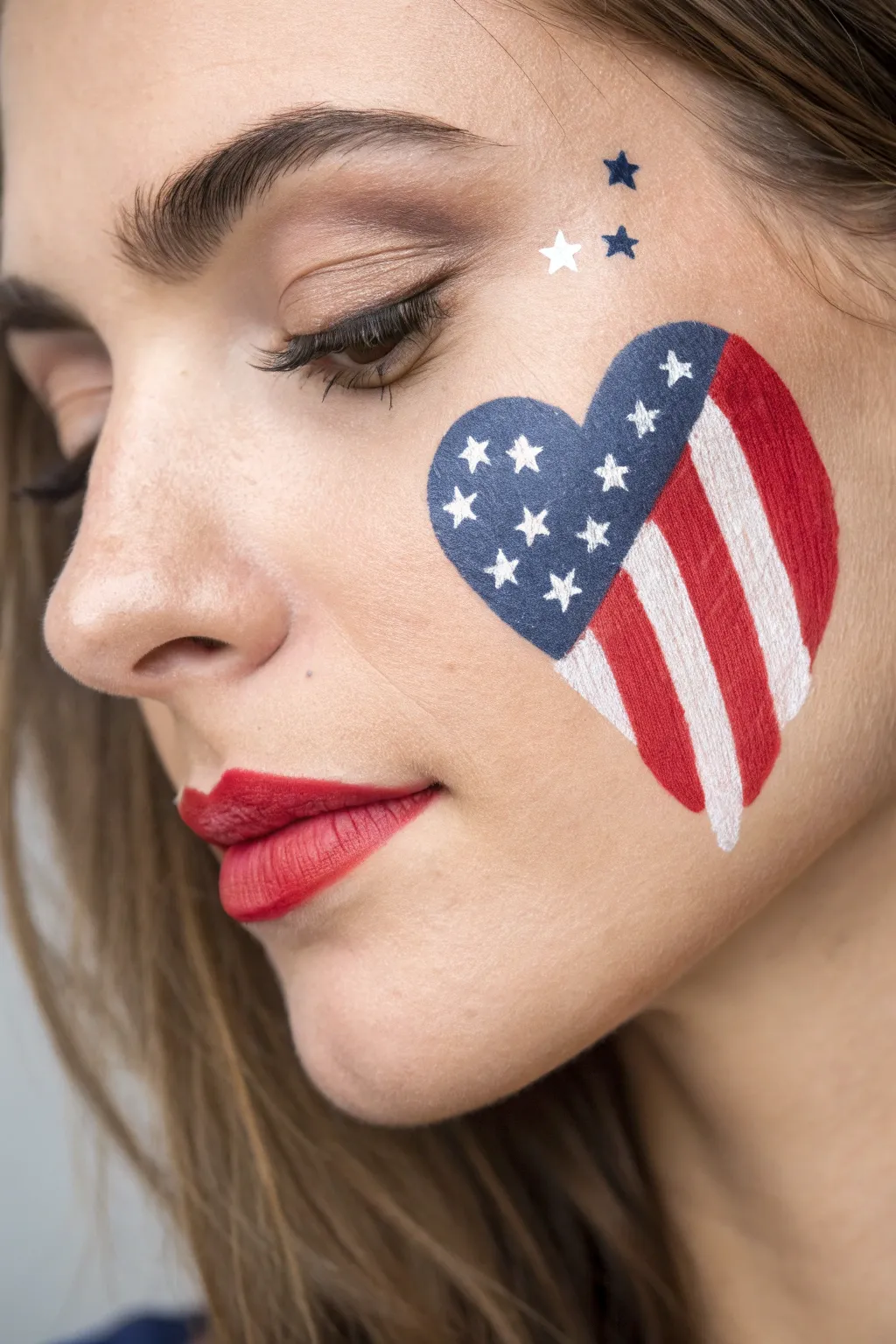 Easy heart face paint with crisp stars and stripes for a clean, bold 4th of July look