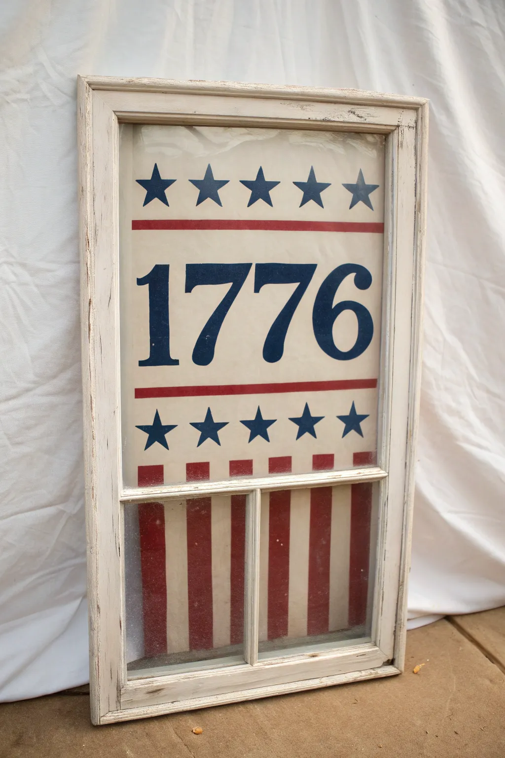 Vintage 1776 window painting with bold stripes, stars, and soft weathering for July 4th