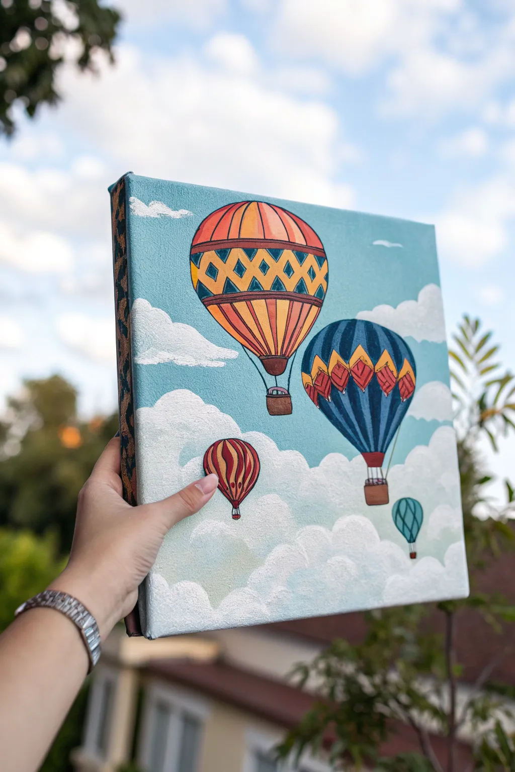 Dreamy acrylic hot air balloons with crisp patterns floating through soft blended clouds