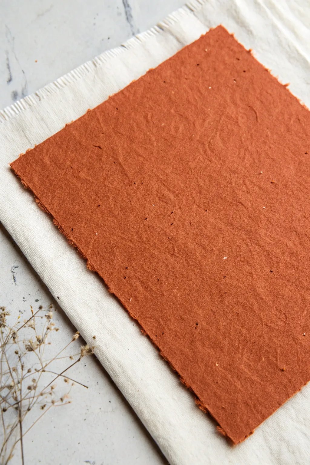 Bold terracotta paper grain illusion with delicate fibers, clean minimal styling, and tactile contrast