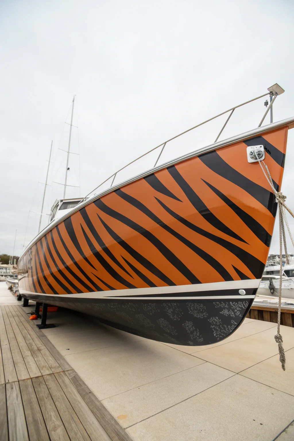 Bold tiger-stripe full hull wrap that transforms a minimalist boat into a striking statement.