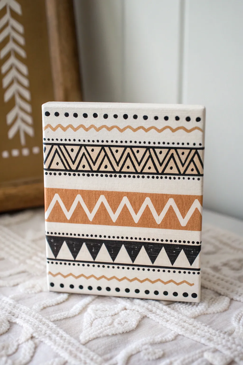 Easy boho geometric bands in black and clay for a warm, minimalist statement painting