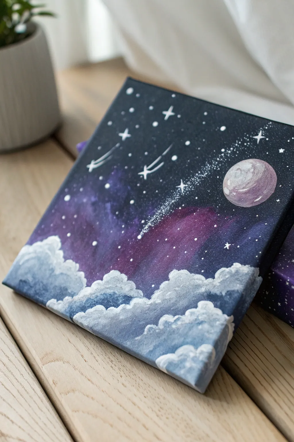 Simple galaxy canvas with splatter stars and one bold planet, kid-friendly and Pinterest pretty