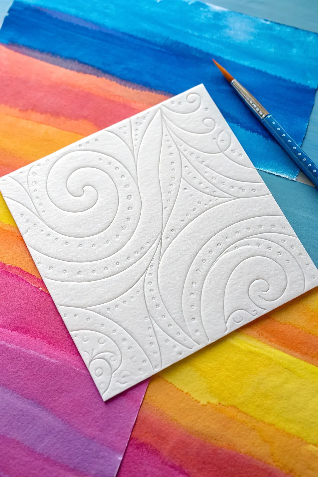 Crisp glue-resist swirls cutting through bold blended chalk pastels for bright, clean lines