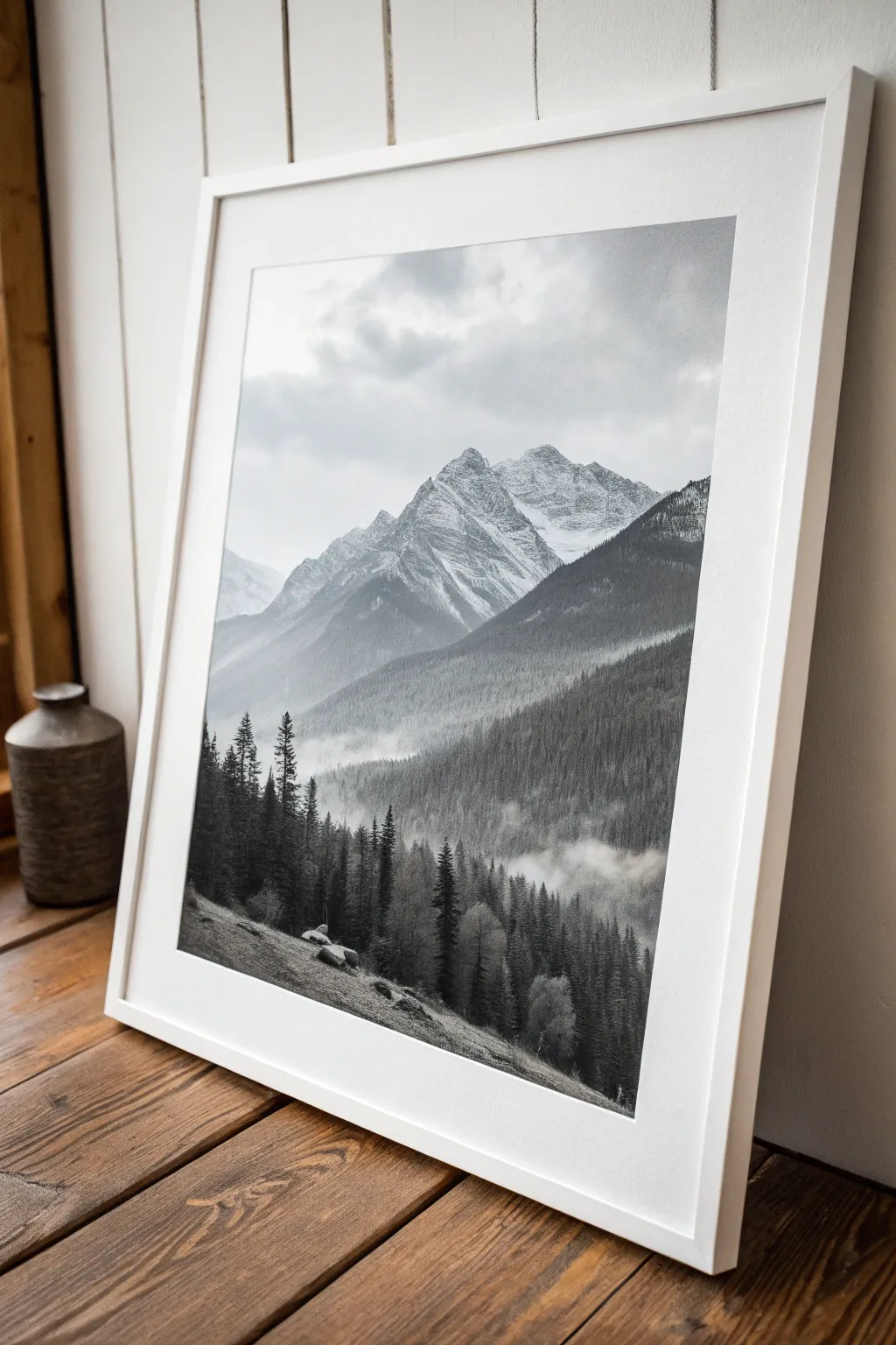 Layered charcoal mountains with lifted snowy ridges for bold contrast and airy depth.