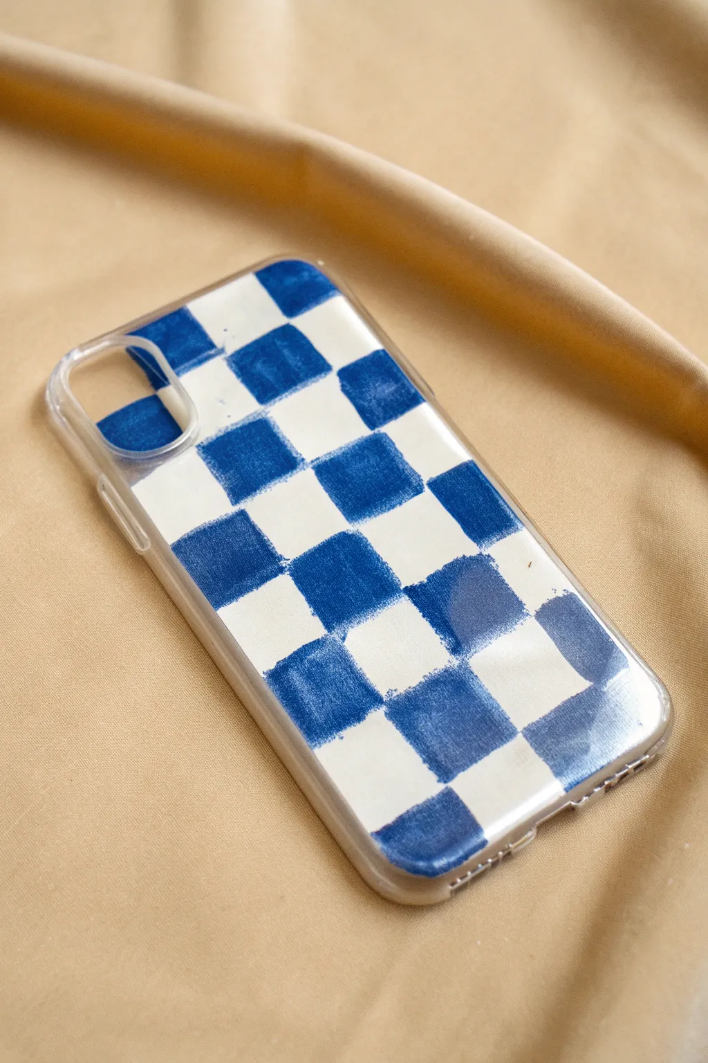 A bold checkerboard corner pop on a clear case for an easy minimalist DIY statement