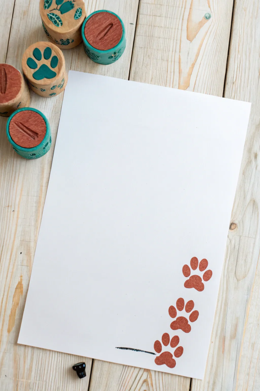 Easy toddler Easter craft: toilet roll bunny tracks stamped in bold color with a tiny bunny doodle.