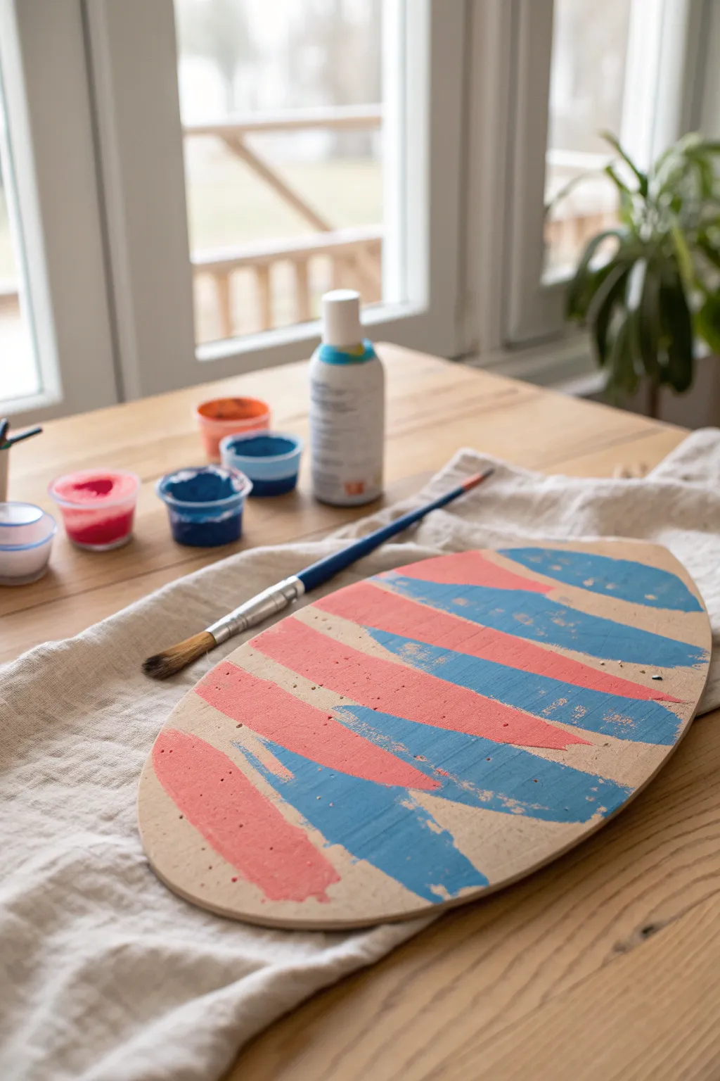 Cardboard egg cutout with big bold brush strokes, made for easy kid-friendly Easter art