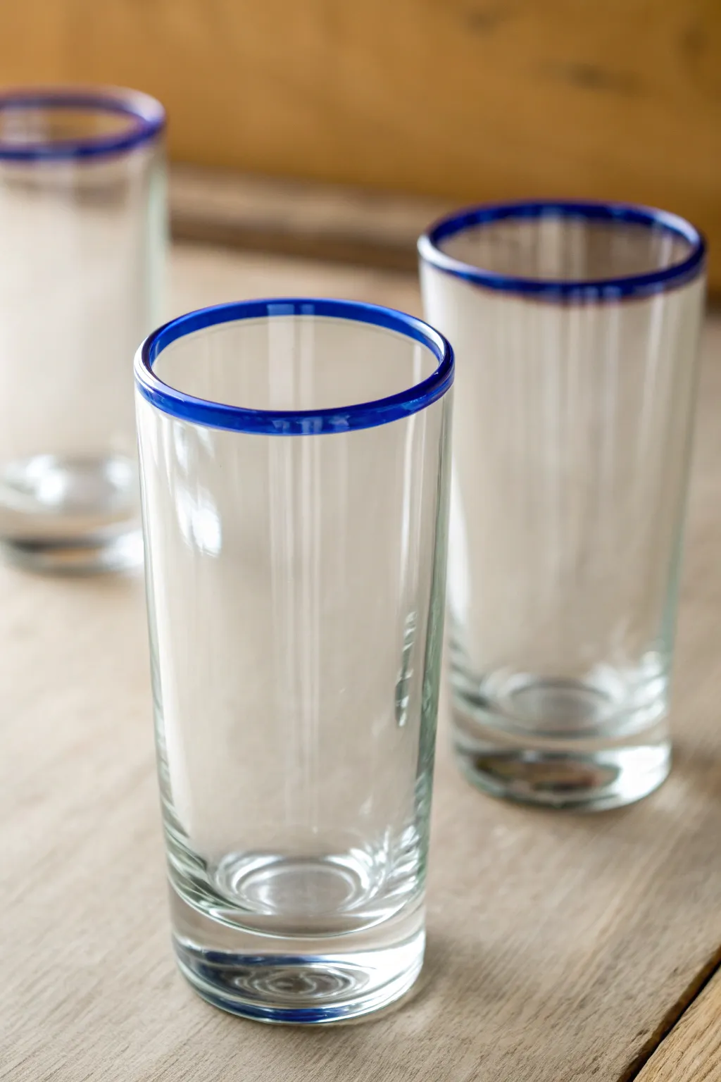 Painted rim dip: a crisp cobalt band gives clear glassware a subtle, modern pop of color.
