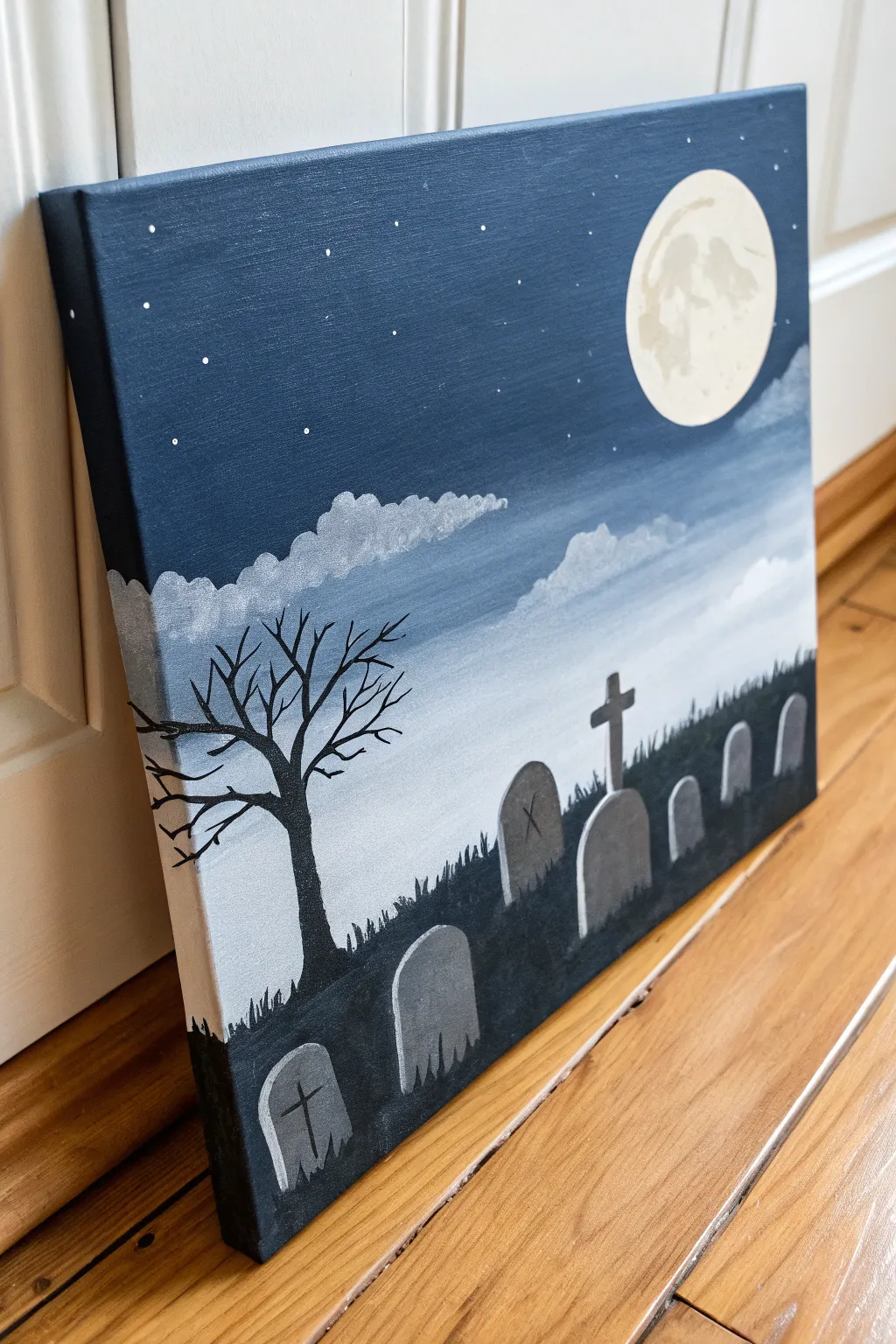 Misty tombstones under a moonlit sky, minimalist Halloween canvas art with bold contrast