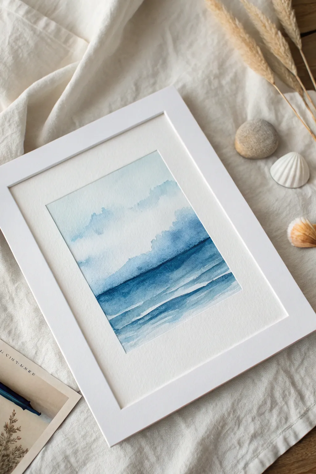 Soothing monochrome blues: gentle abstract washes on crisp paper for a calm painting session.