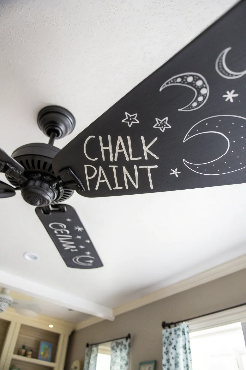 Transform your ceiling fan into a whimsical masterpiece with chalkboard paint! 🌙✨ Playful and chic.