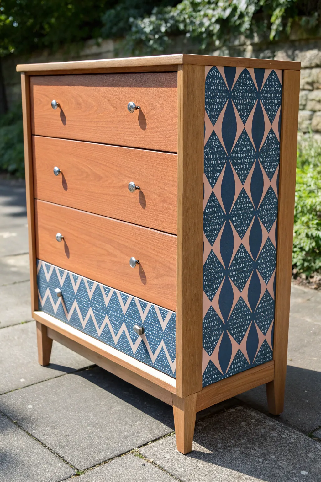 Crisp stenciled drawer fronts turn a simple dresser into bold, patterned statement furniture.