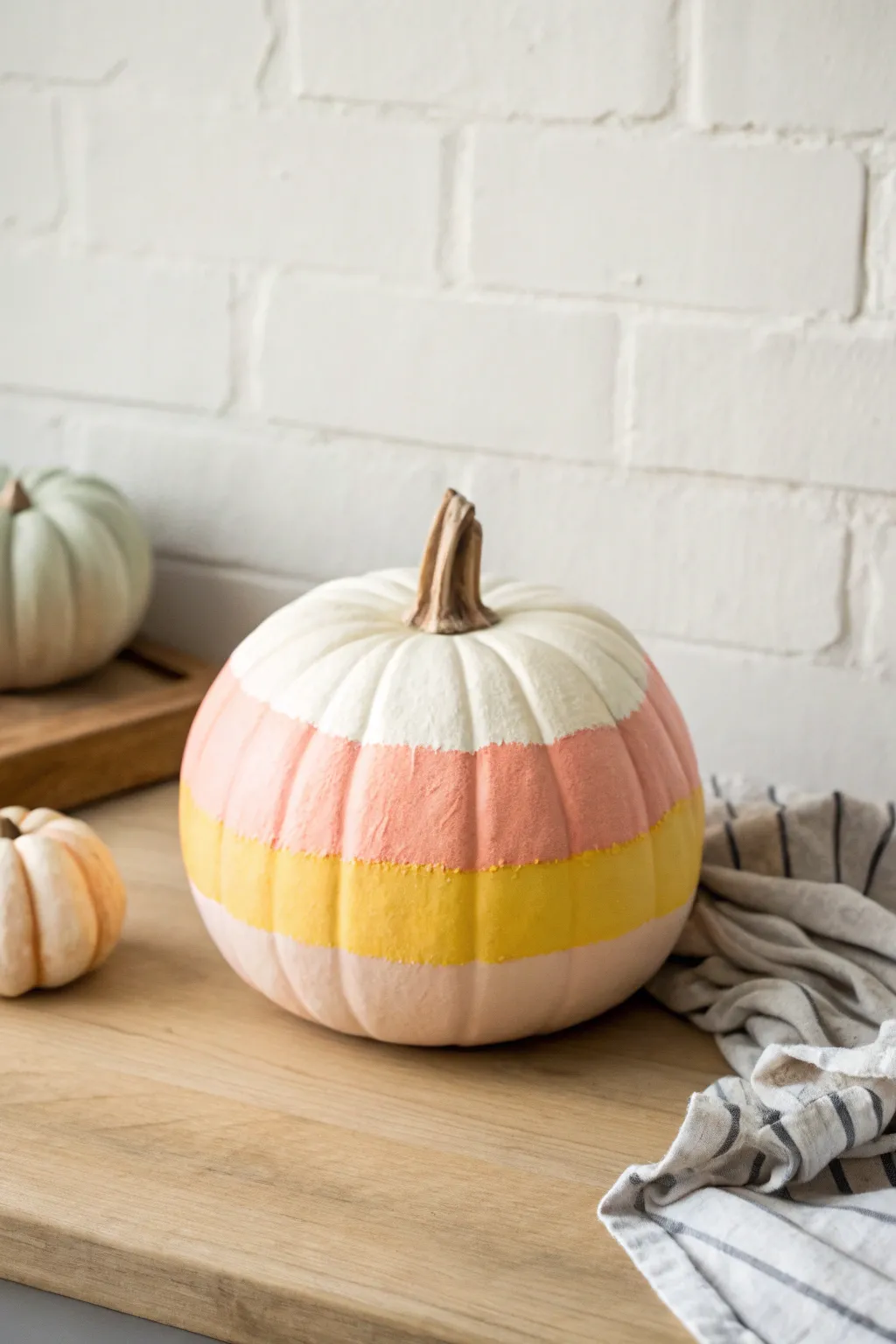 Pastel candy corn pumpkin idea with clean Scandinavian lines and a soft boho pop of color