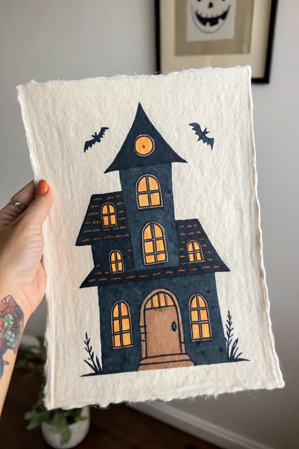 Haunted house face drawing: glowing window eyes and a door-mouth in bold minimalist boho style