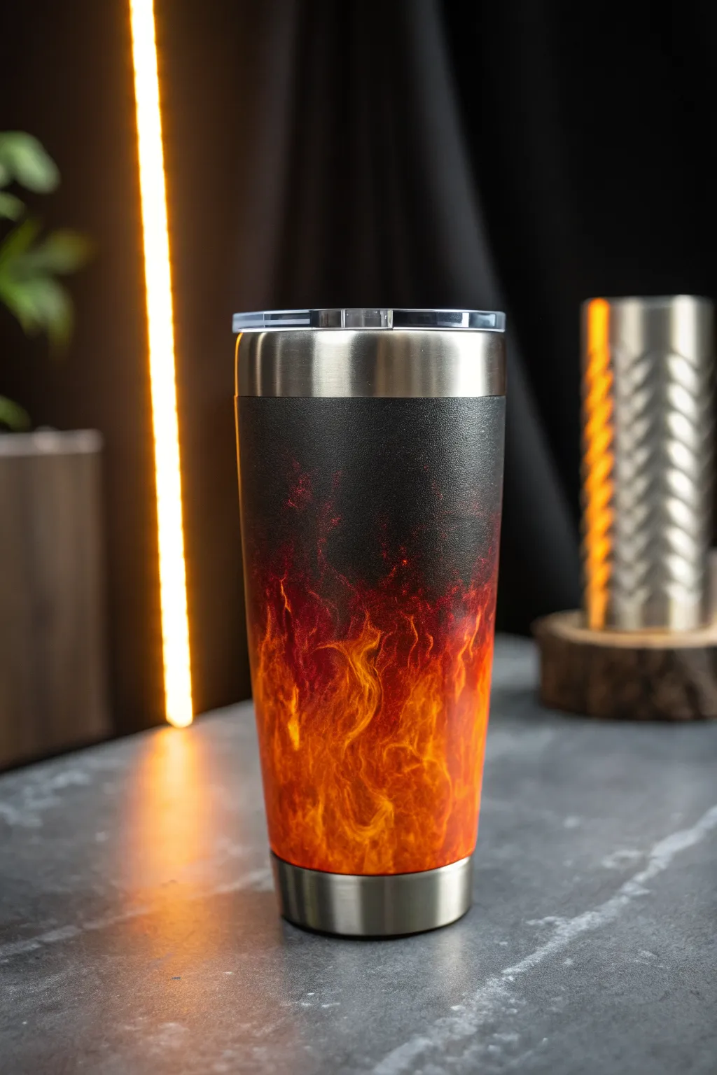 Fire Fade epoxy tumbler: charcoal base melting into ember reds, glowing with rim light.