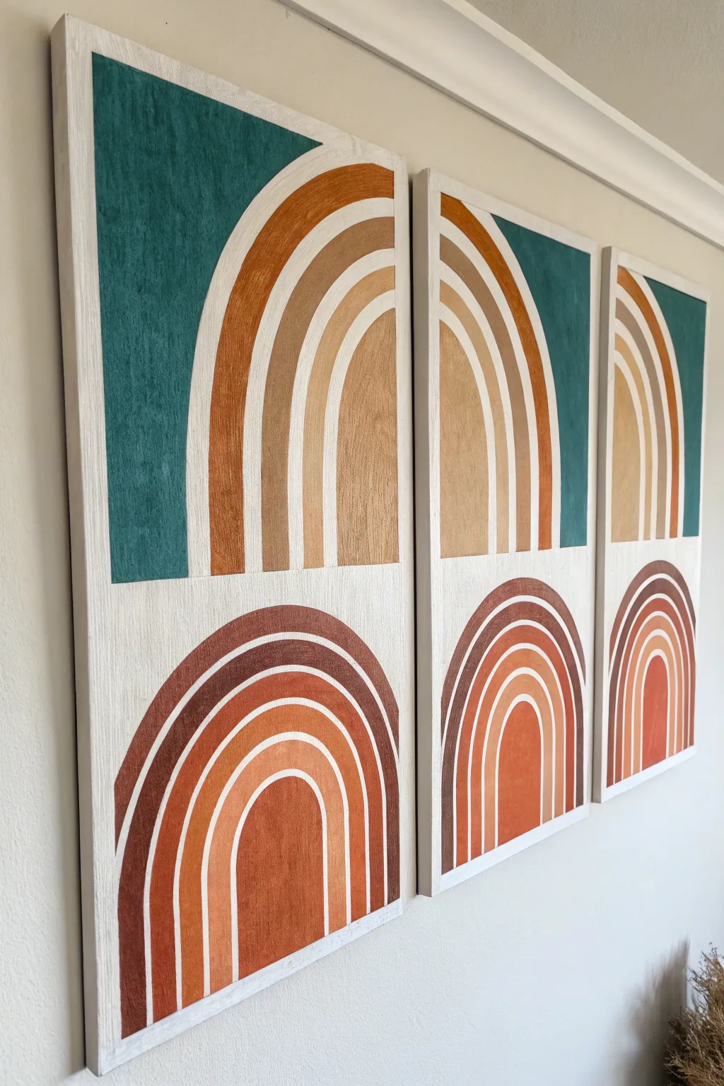 Minimalist triptych with repeated arches in shifting hues for a cohesive color story