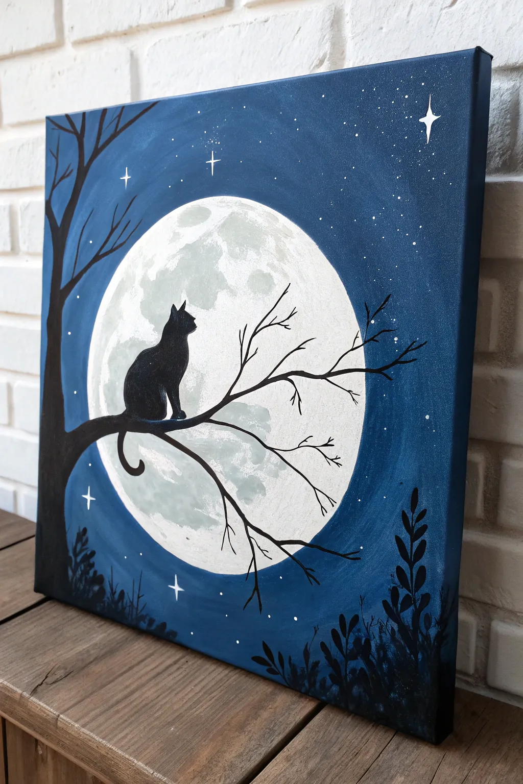 Minimalist cat silhouette under a pale moon, bold contrast and cozy paint night inspiration