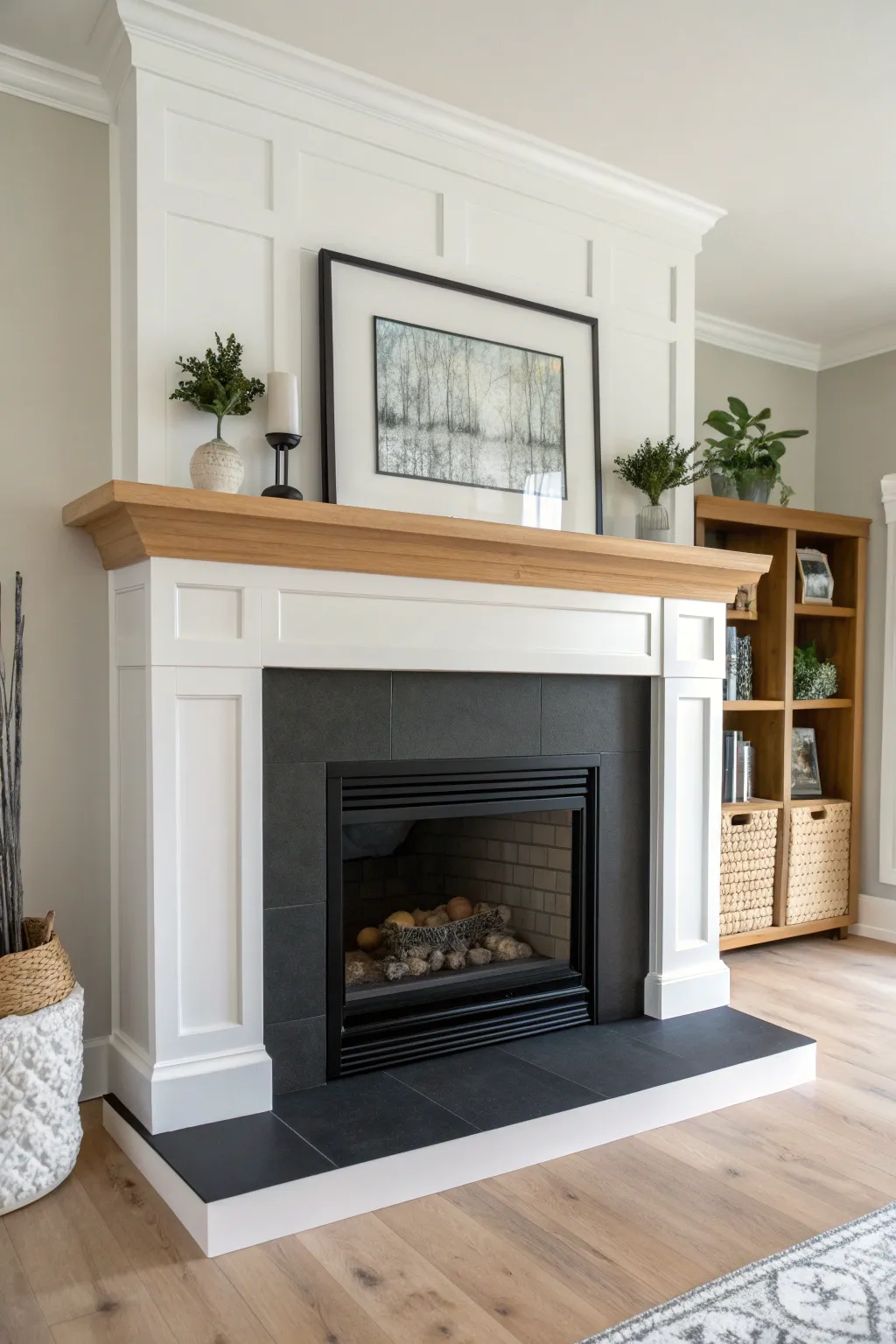Two-tone mantel contrast: black shelf, white surround, crisp lines that frame the firebox