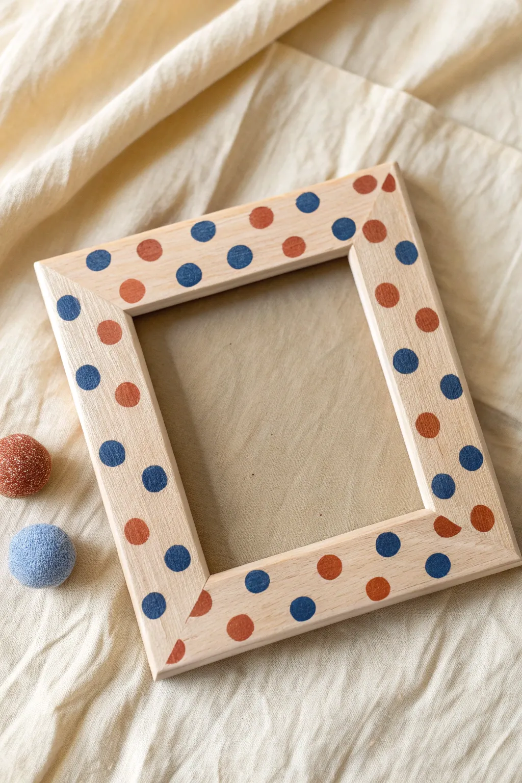 Playful polka dot painted frame in bold boho hues, with a sponge tip hint for an easy DIY.