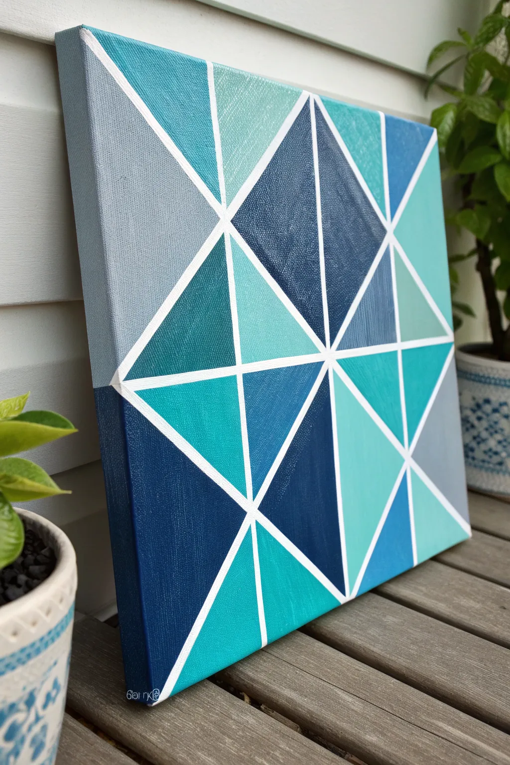 Cool-toned geometric canvas for boys with crisp negative-space lines and bold modern shapes