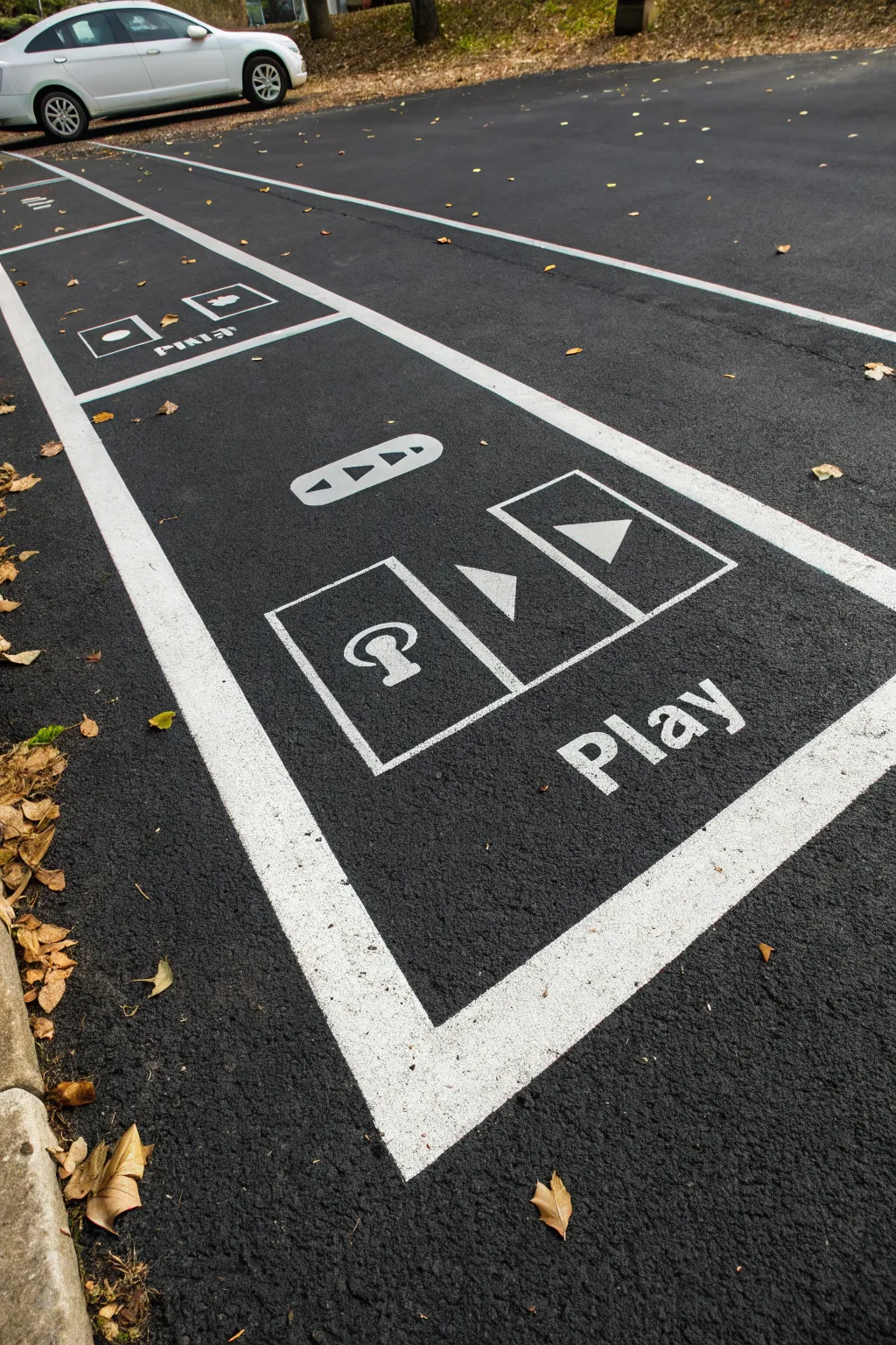 Paint a parking space like a bold minimalist music player screen with boho color blocks and crisp contrast