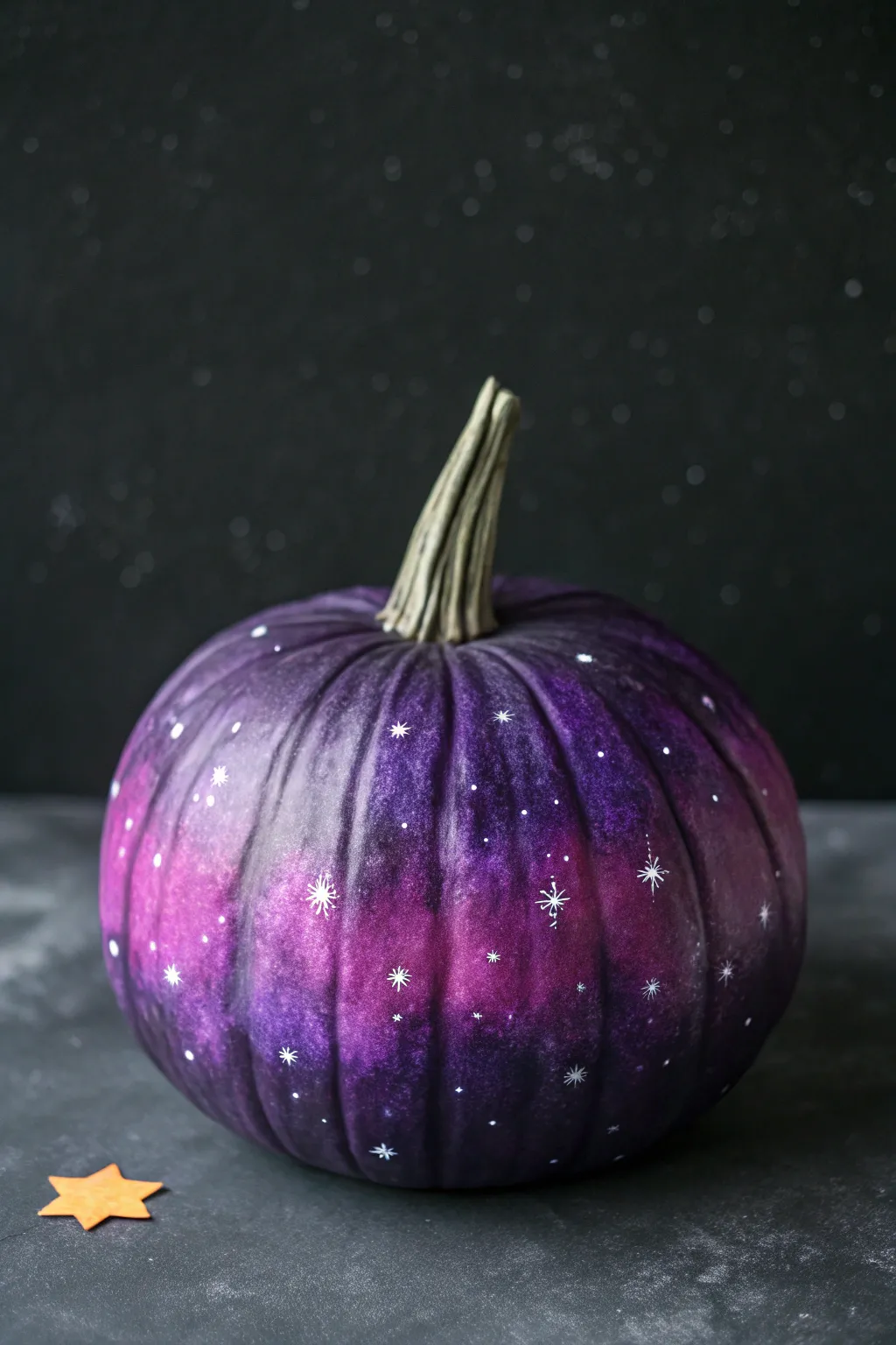 Galaxy night-sky purple pumpkin with bold contrast, starry speckles, and moody minimalist vibes
