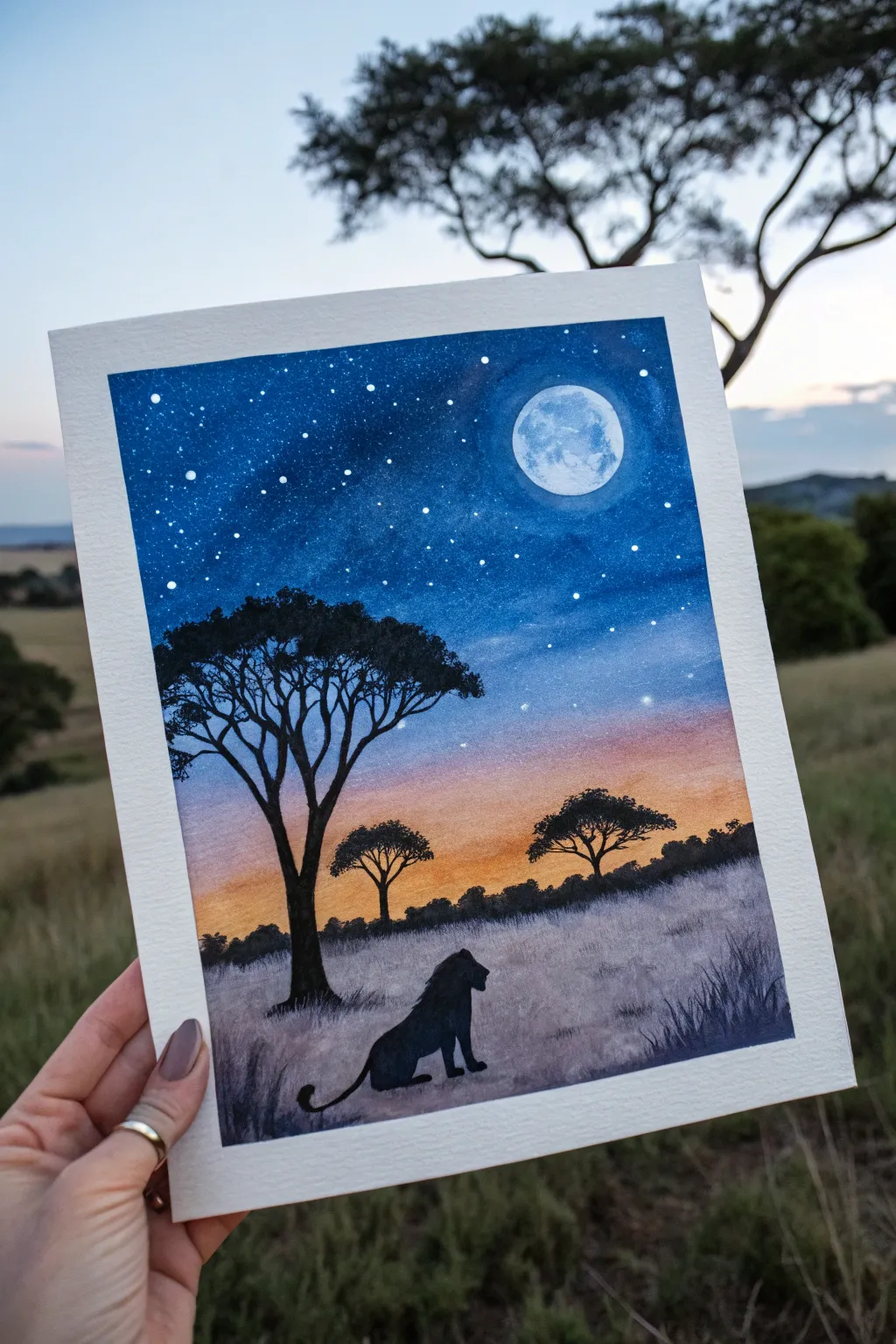 Night safari painting idea: indigo sky, glowing moon, and a simple lion silhouette with bold contrast