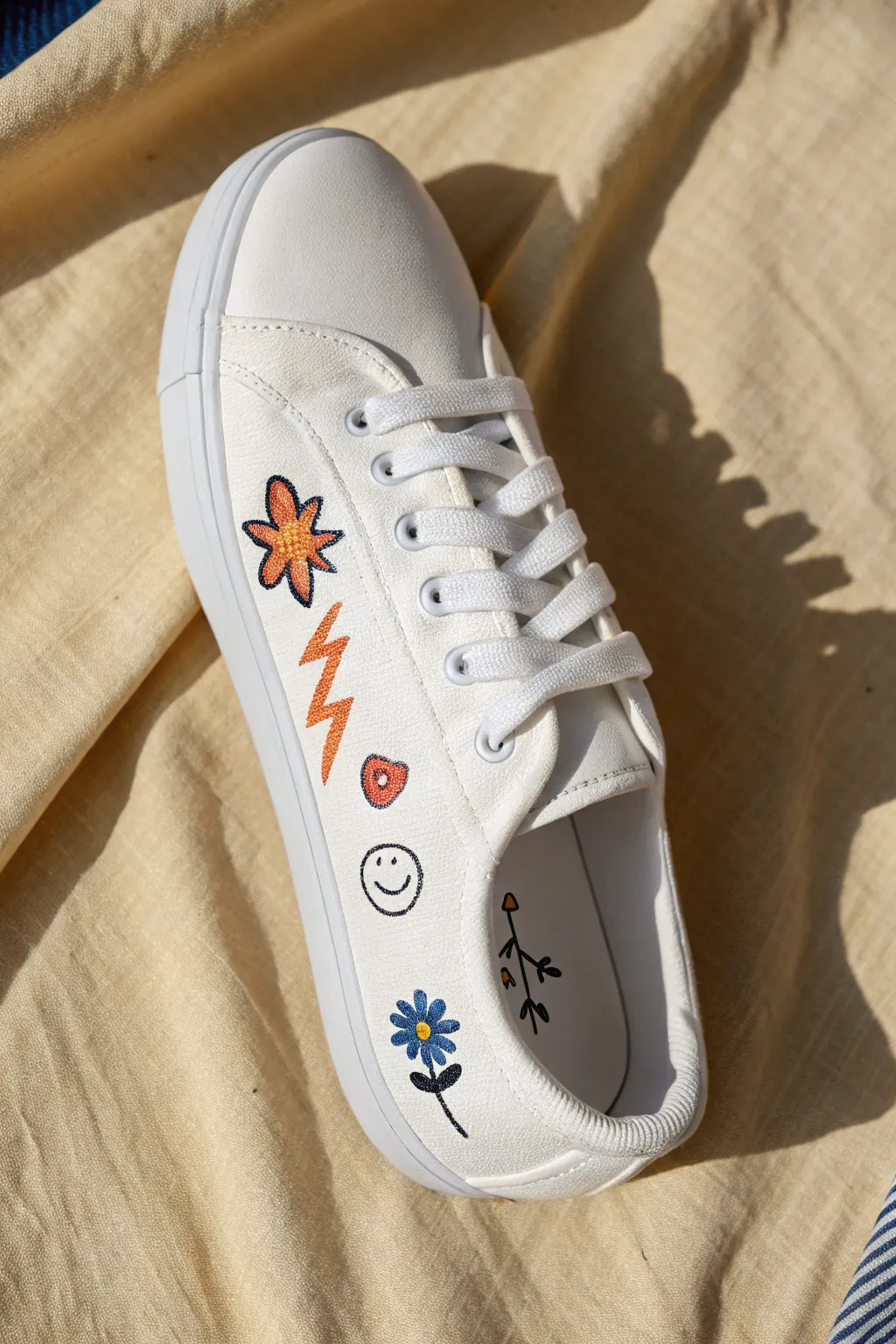 Minimal sneaker art with bold outlined sticker icons for an easy, modern DIY shoe paint idea.