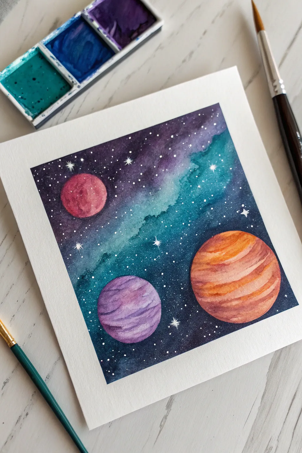 Tiny galaxy acrylic painting with bold planets and speckled stars, minimal Scandinavian vibe