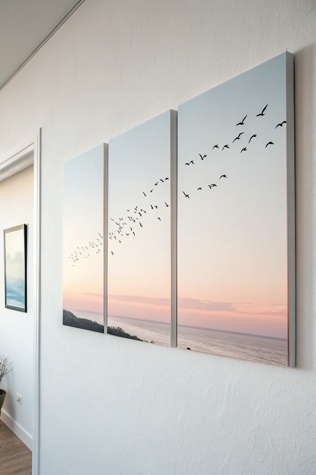 Split canvas birds in flight, flowing seamlessly across three panels in bold minimalist style