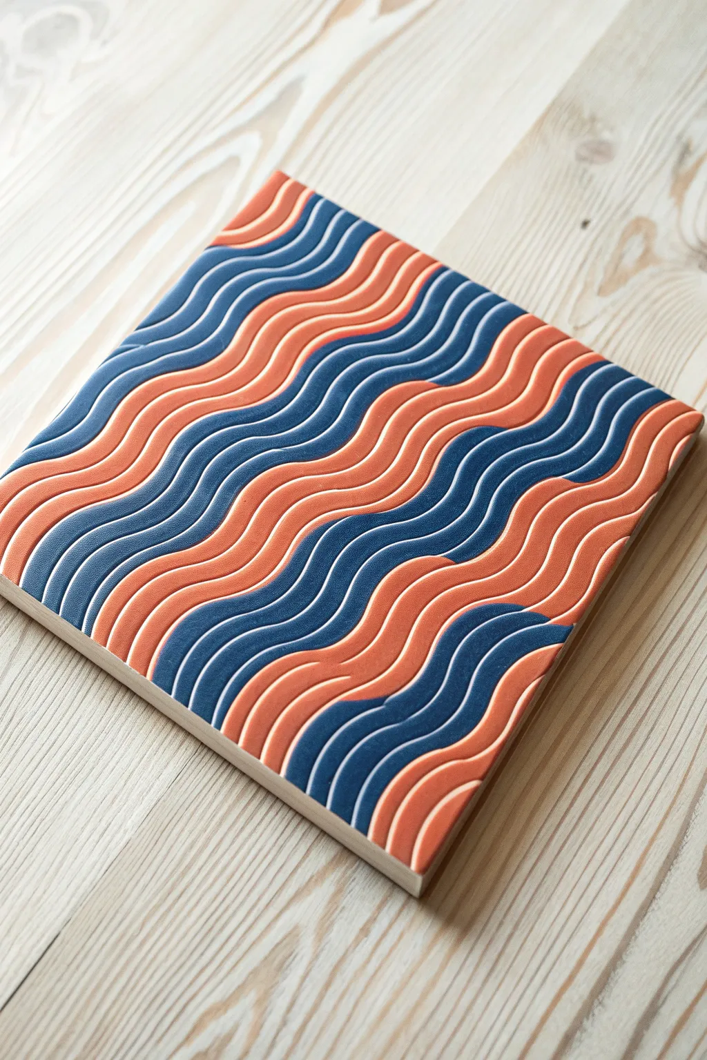 Comb-raked acrylic waves with crisp, even ridges and bold color contrast for a modern look