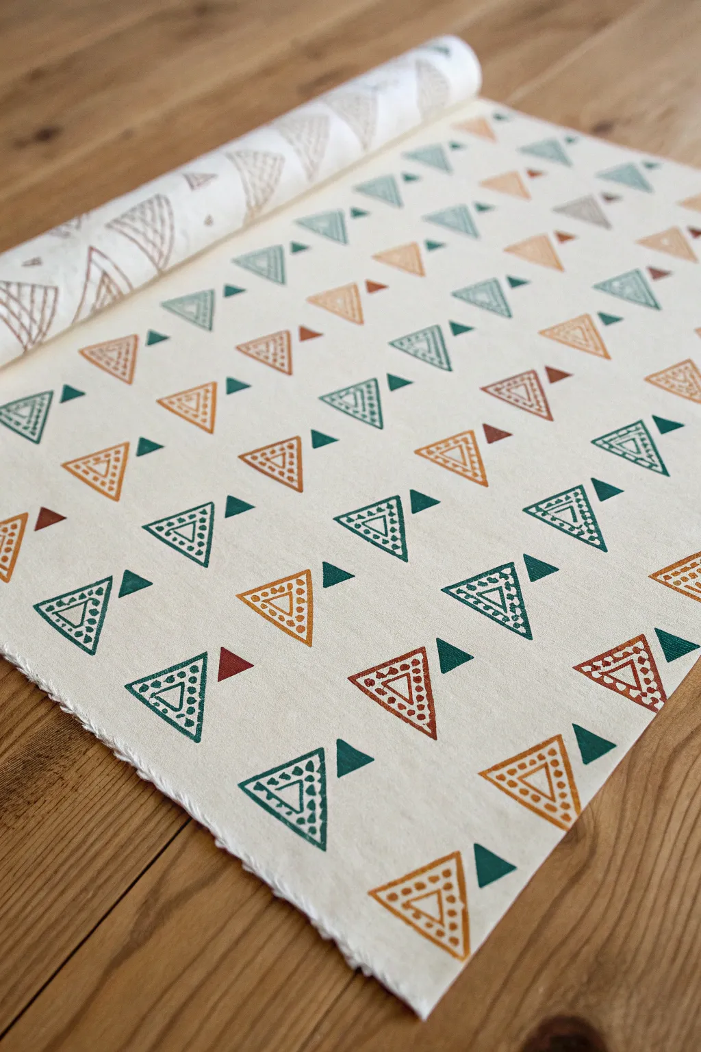 Triangle stamp pattern play in bold inks, clean negative space, and handcrafted paper texture.