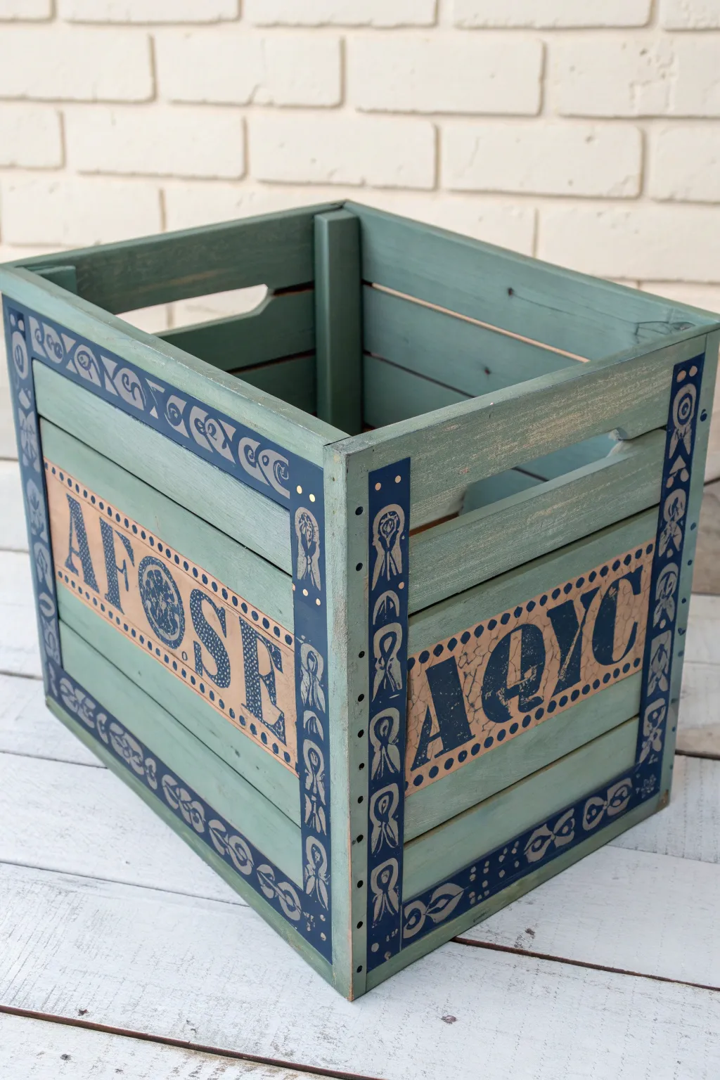 Muted sage crate with bold vintage label panel and softly aged edges for cozy minimalist storage.