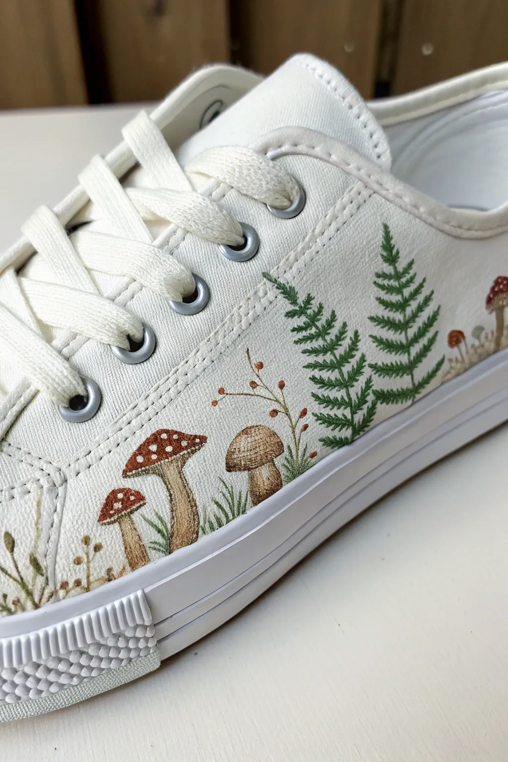 Hand-painted sneaker with earthy mushrooms and fern fronds for cozy woodland acrylic inspiration.