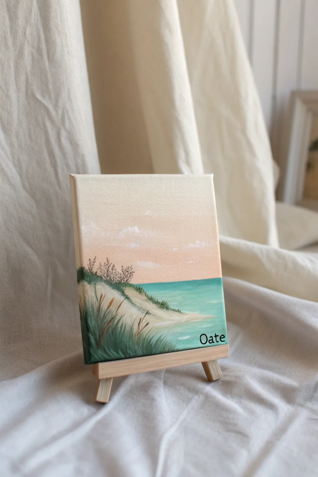 Paint a tiny proposal-spot landscape on canvas, add a couple silhouette and your date in the corner.