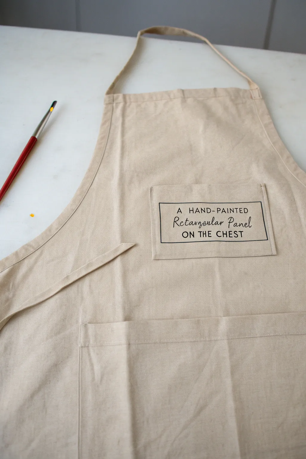 Minimal apron label panel with bold hand-lettering strokes and faint pencil guidelines, recipe vibe.
