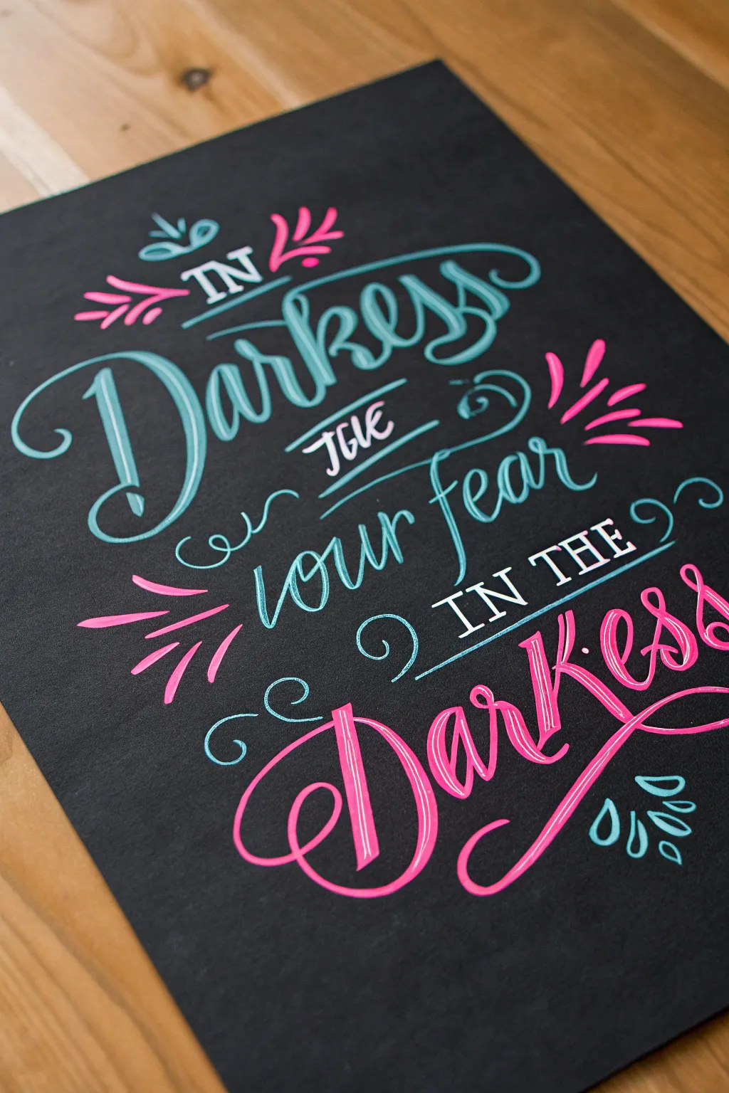 Minimal blacklight calligraphy art with glowing neon outlines and bold, handcrafted strokes