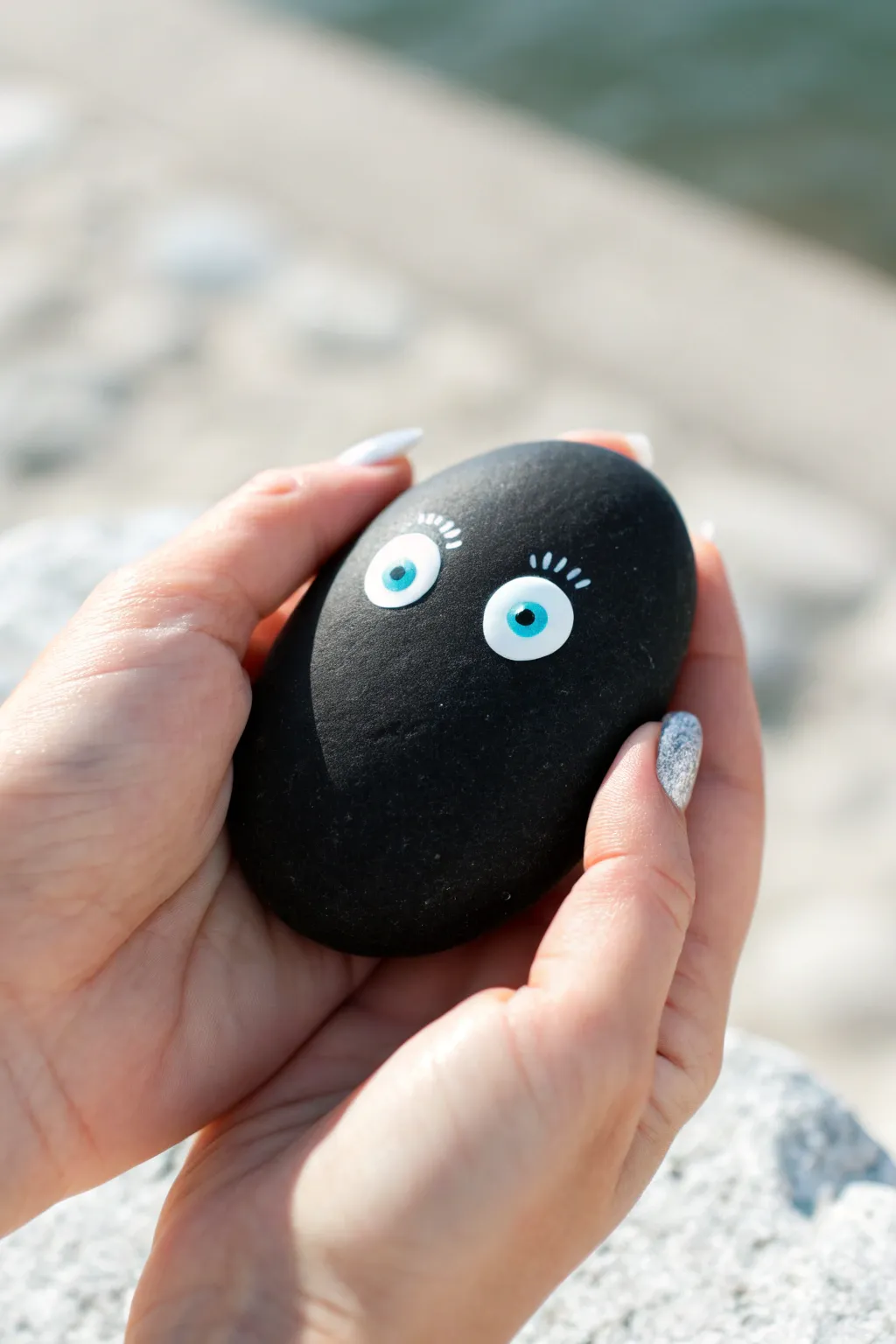 Mysterious black rock with peeking eyes, high-contrast minimalist boho painting inspiration