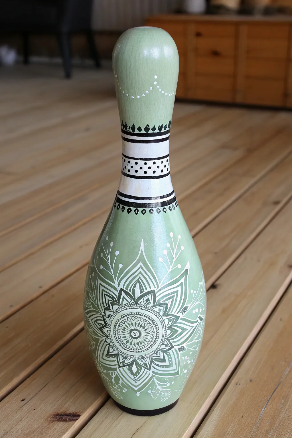 A calm sage bowling pin with a crisp mandala band, perfect for minimalist boho painting ideas.