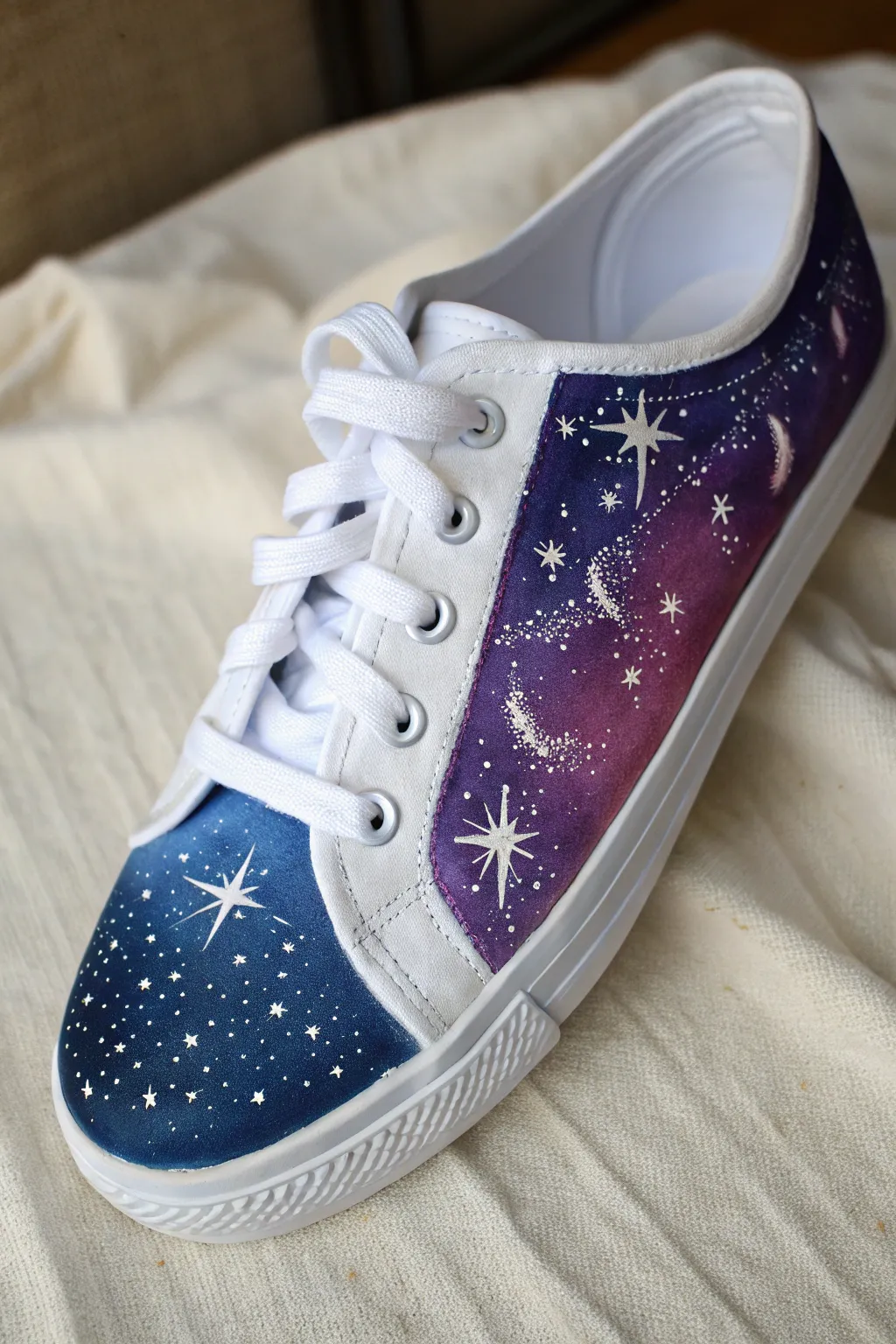 Galaxy night sky canvas sneaker with splatter stars, moody minimalist boho contrast.