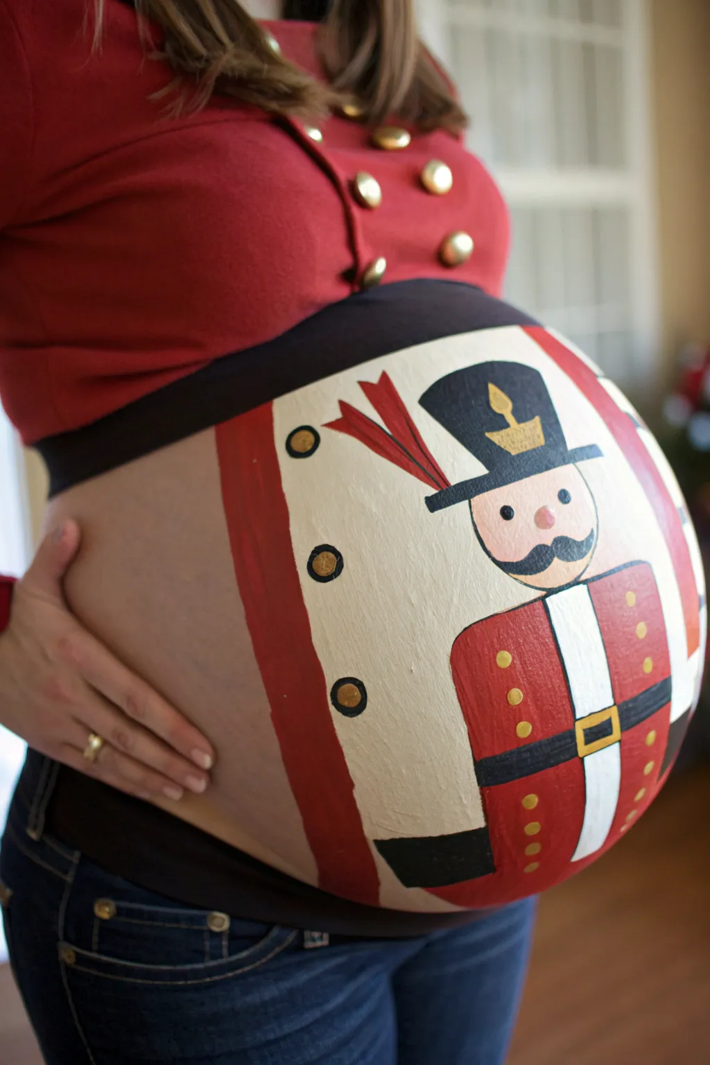 Nutcracker toy soldier belly art with bold jacket panels, buttons, and belt in cozy minimal style