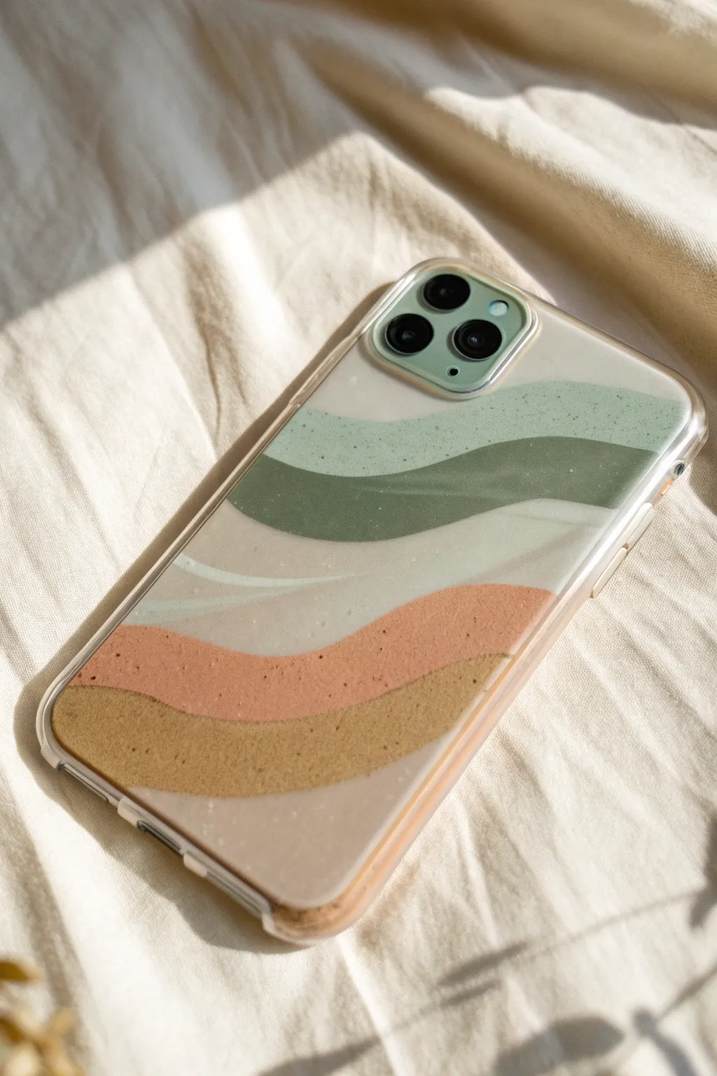 Soft wavy paint bands on a clear case, leaving see-through gaps for a modern minimalist look