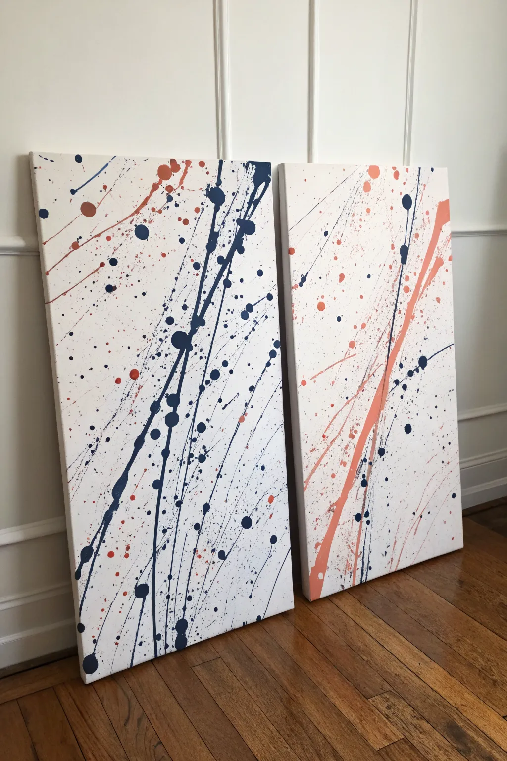Two-panel splatter diptych with a connected paint flow, styled clean and modern with a chic gap.