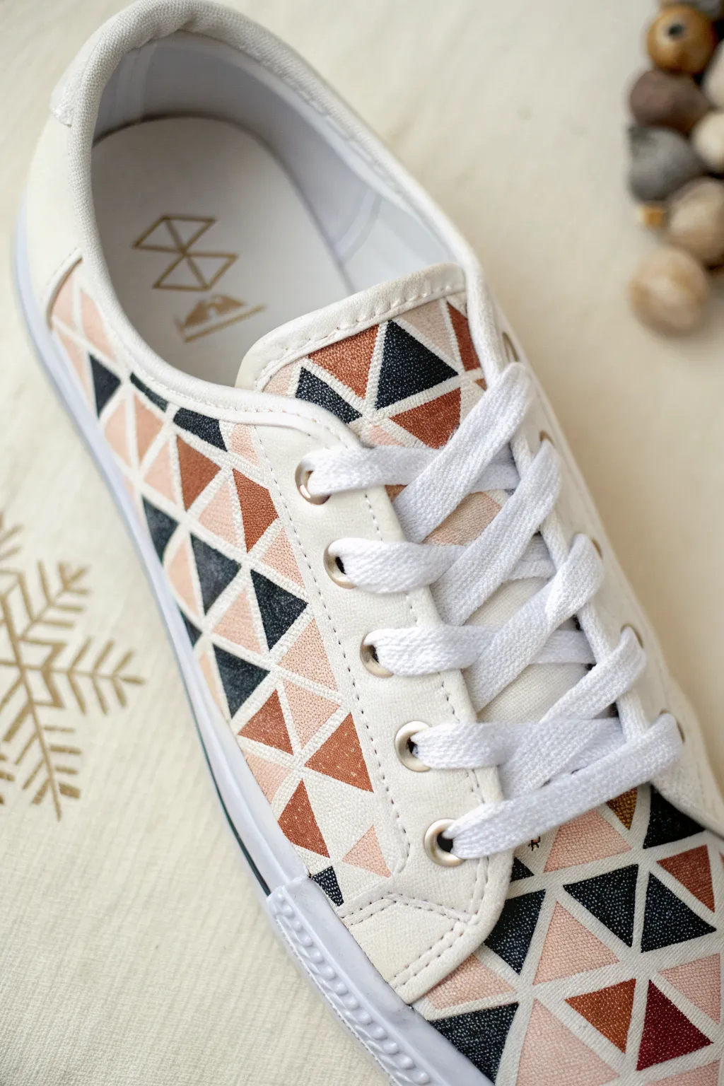 Geometric triangle mosaic sneaker with pencil guides and paint markers, minimalist boho vibe.
