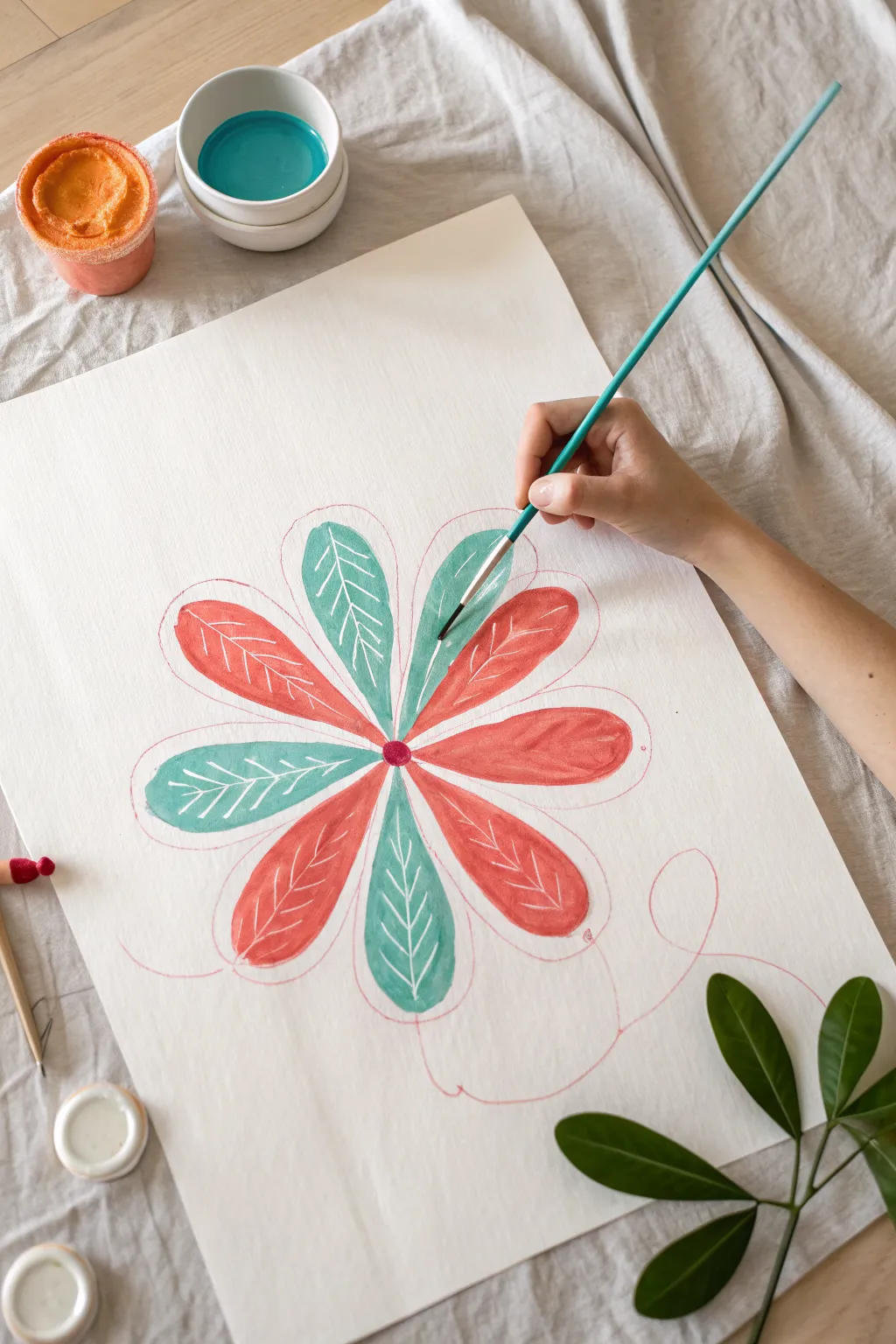 String-pull flower prints made easy: pull painted string for bold petals on clean white paper