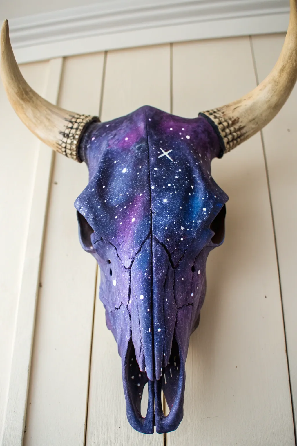 Galaxy night sky cow skull with starry speckles and a soft nebula glow, minimalist backdrop